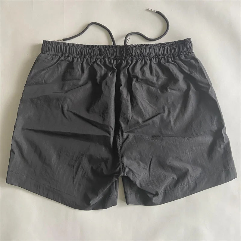 Top quality luxury knee-length summer youth leisure sports nylon shorts loose men's beach 5-point pants
