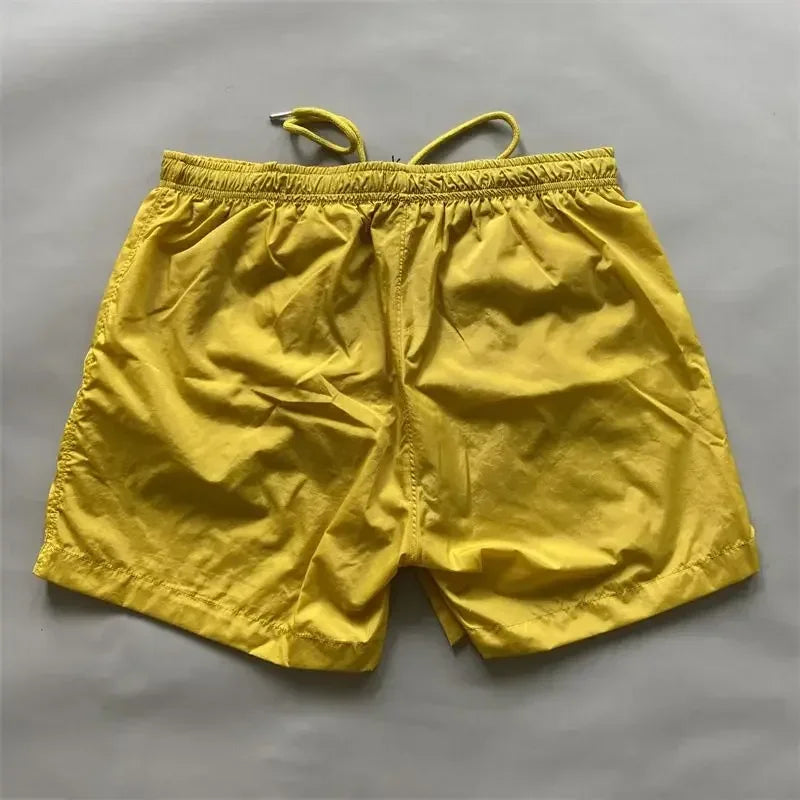 Top quality luxury knee-length summer youth leisure sports nylon shorts loose men's beach 5-point pants