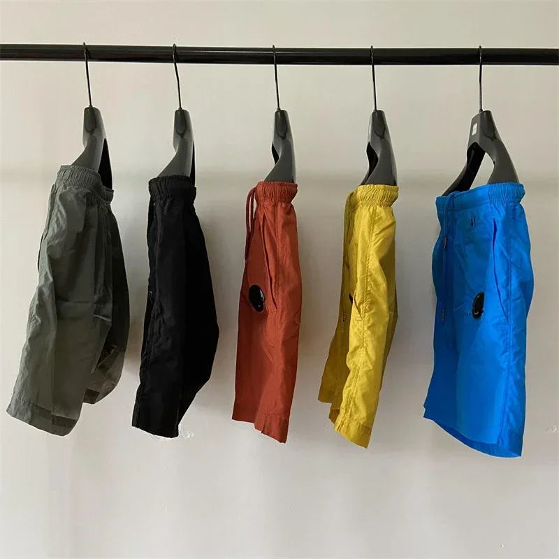 Top quality luxury knee-length summer youth leisure sports nylon shorts loose men's beach 5-point pants