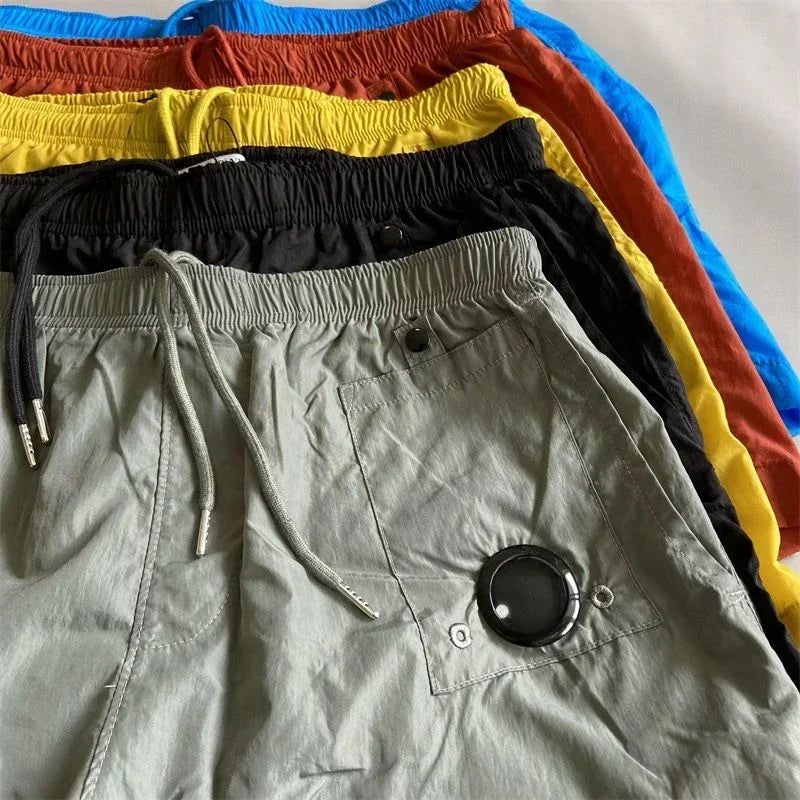 Top quality luxury knee-length summer youth leisure sports nylon shorts loose men's beach 5-point pants