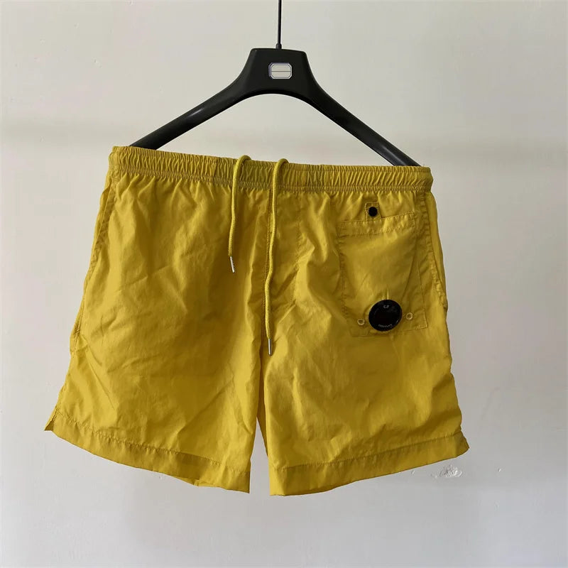 Top quality luxury knee-length summer youth leisure sports nylon shorts loose men's beach 5-point pants