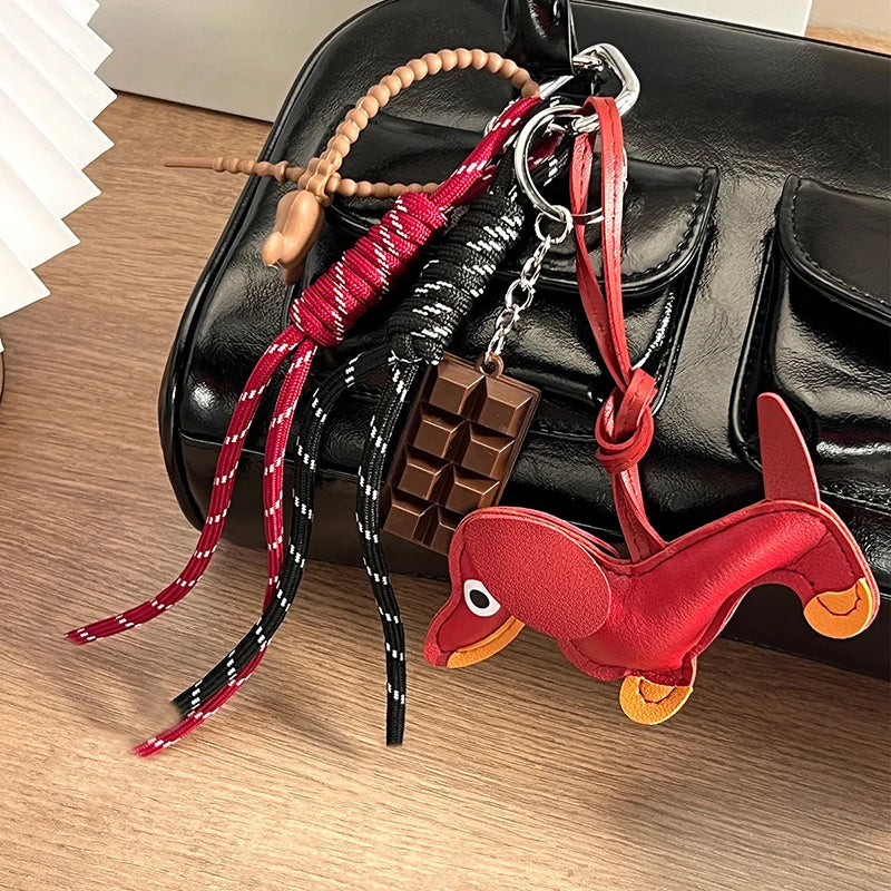 Vintage-Schlüsselanhänger aus PU-Leder mit Dackel-Welpe, geflochtenem Seilanhänger, modischem Schokoladen-Schlüsselanhänger, Damen-Taschenanhänger, Schlüsselhalter, Geschenke