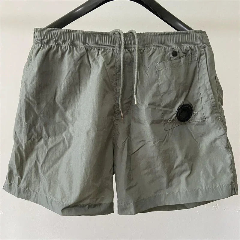 Top quality luxury knee-length summer youth leisure sports nylon shorts loose men's beach 5-point pants