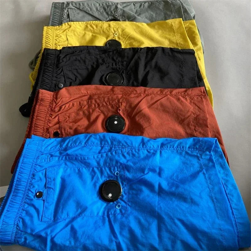 Top quality luxury knee-length summer youth leisure sports nylon shorts loose men's beach 5-point pants