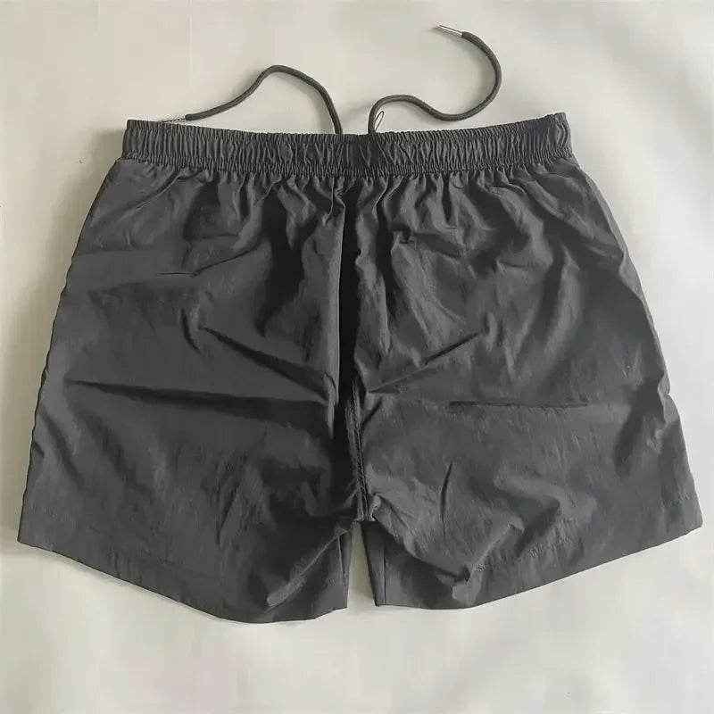 Top quality luxury knee-length summer youth leisure sports nylon shorts loose men's beach 5-point pants