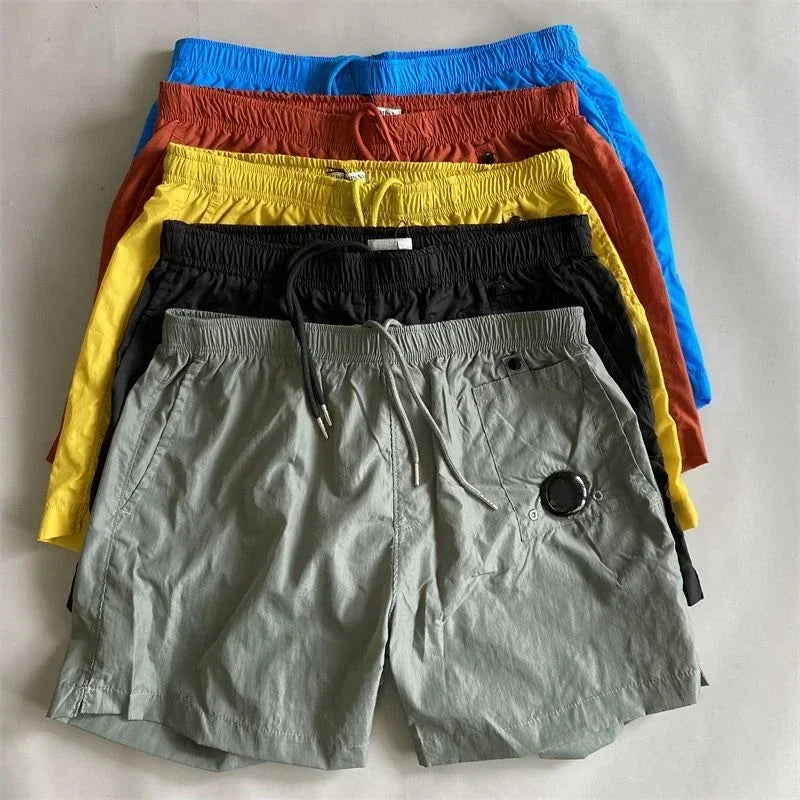 Top quality luxury knee-length summer youth leisure sports nylon shorts loose men's beach 5-point pants